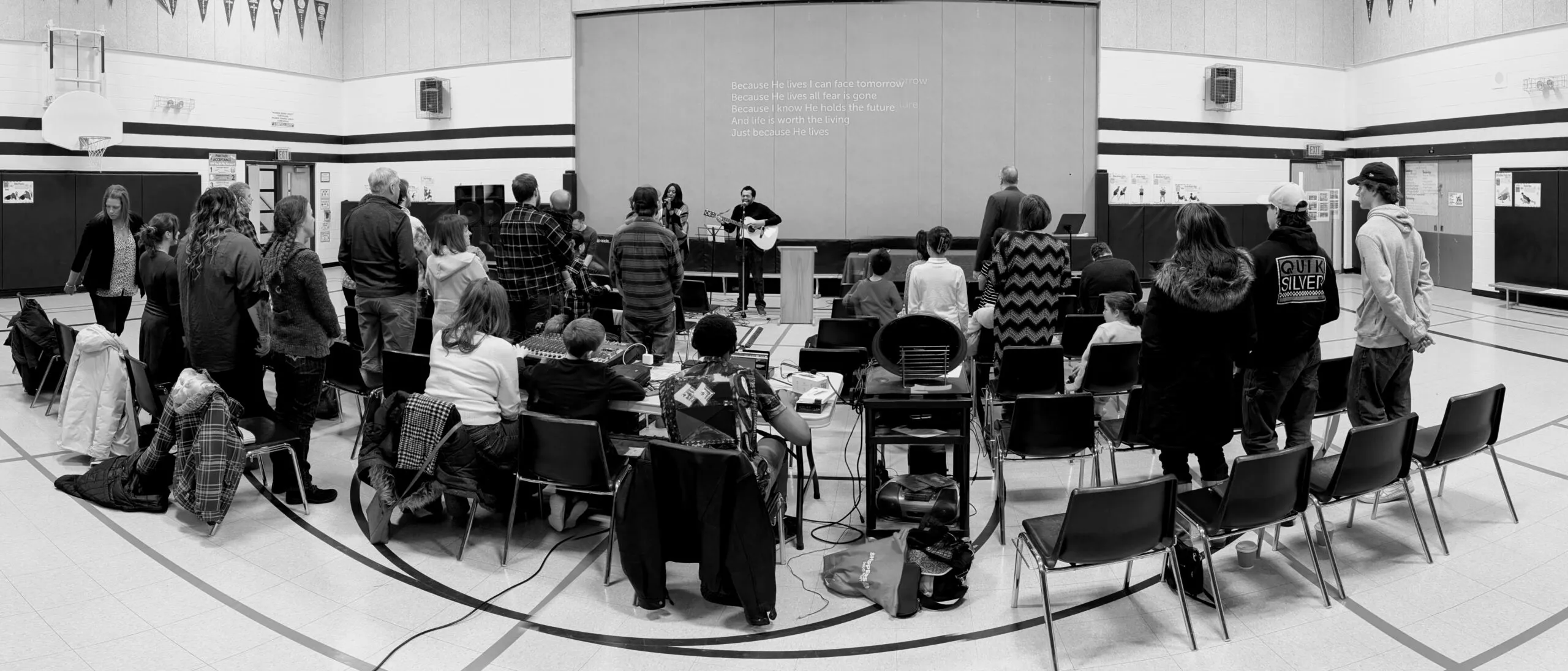 The church family gathered in the school gym on a Sunday morning